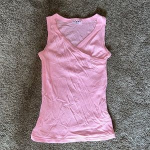 Light pink Michael Stars sleeveless top with crisscross neckline.